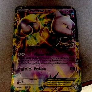 This a rare large mewtwo a very good Pokémon card the card is large and rare